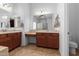 Double vanity bathroom with a view into the shower and toilet at 9845 E Inglewood St, Mesa, AZ 85207