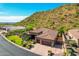 Single-story home with a two-car garage and mountain views at 9845 E Inglewood St, Mesa, AZ 85207