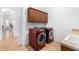 Bright laundry room, featuring washer, dryer, and ample cabinetry at 9845 E Inglewood St, Mesa, AZ 85207