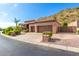Two-story house with a three-car garage and desert landscaping at 9845 E Inglewood St, Mesa, AZ 85207