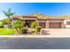 Beautiful home with stone accents and a three-car garage at 9845 E Inglewood St, Mesa, AZ 85207