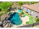 Resort-style backyard with a pool, spa, and putting green at 9845 E Inglewood St, Mesa, AZ 85207