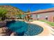 Relaxing pool and spa area with a waterfall and mountain views at 9845 E Inglewood St, Mesa, AZ 85207