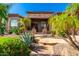 Front entry with stone pillars and desert landscaping at 9845 E Inglewood St, Mesa, AZ 85207