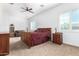 Bright bedroom featuring a large bed and sitting area at 9845 E Inglewood St, Mesa, AZ 85207