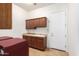 Laundry room with washer, dryer, and cabinets at 9845 E Inglewood St, Mesa, AZ 85207