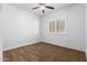 Spacious bedroom with a ceiling fan and window shutters at 9845 E Inglewood St, Mesa, AZ 85207