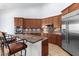 Kitchen boasts granite countertops, stainless steel appliances, and an island at 9845 E Inglewood St, Mesa, AZ 85207