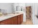 Double vanity bathroom with a shower and tub at 9845 E Inglewood St, Mesa, AZ 85207