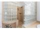 Glass block shower with tiled floors and walls at 9845 E Inglewood St, Mesa, AZ 85207