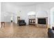 Living area featuring a fireplace and built-in shelving at 9845 E Inglewood St, Mesa, AZ 85207