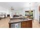 Kitchen with island, stainless steel appliances, and view into dining area at 9845 E Inglewood St, Mesa, AZ 85207