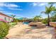 Inviting pool area with fire pit and mountain views at 9845 E Inglewood St, Mesa, AZ 85207