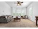 Spacious living room featuring comfortable seating and a large bay window at 9845 E Inglewood St, Mesa, AZ 85207