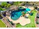 Luxury backyard with pool, spa, waterfall, and putting green at 9845 E Inglewood St, Mesa, AZ 85207