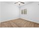 Simple bedroom with carpeted floors and a ceiling fan at 9845 E Inglewood St, Mesa, AZ 85207