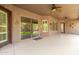 Covered patio with sliding glass doors leading to backyard at 9845 E Inglewood St, Mesa, AZ 85207