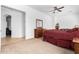 Comfortable bedroom with ensuite access and wood furniture at 9845 E Inglewood St, Mesa, AZ 85207