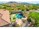 Backyard oasis with pool, spa, putting green and mountain views at 9845 E Inglewood St, Mesa, AZ 85207