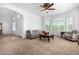 Bright living room with comfy seating and a view of the entryway at 9845 E Inglewood St, Mesa, AZ 85207