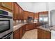 Modern kitchen featuring granite countertops and stainless steel appliances at 9845 E Inglewood St, Mesa, AZ 85207