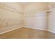 Spacious walk-in closet with ample shelving and hanging space at 19301 N Ponderosa Ct, Surprise, AZ 85387