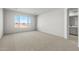 Spacious bedroom with large window and carpet flooring at 9951 S Centennial Rd, Apache Junction, AZ 85120