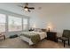 Main bedroom with carpeted floors and ceiling fan at 379 E Las Puertas Ln, Queen Creek, AZ 85140