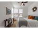 Well-lit bedroom with a comfortable bed and a ceiling fan at 379 E Las Puertas Ln, Queen Creek, AZ 85140