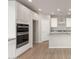 Modern kitchen with double oven and white cabinets at 1445 W Saddle Run, Apache Junction, AZ 85120