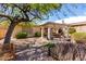 Relaxing backyard with covered patio and mature trees at 41313 N Rolling Green Way, Anthem, AZ 85086