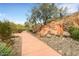 Community entrance with stone sign and walking path at 10804 N Mangrum Ct, Fountain Hills, AZ 85268