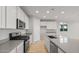 Modern kitchen with gray countertops and stainless steel appliances at 1521 W Saddle Run, Apache Junction, AZ 85120