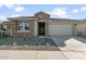 Single story home with brick facade and two car garage at 1521 W Saddle Run, Apache Junction, AZ 85120