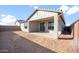 Covered patio and spacious backyard with desert landscaping at 1521 W Saddle Run, Apache Junction, AZ 85120