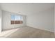 Spacious bedroom with carpeted floors and a large window at 1521 W Saddle Run, Apache Junction, AZ 85120