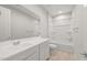 Clean bathroom with a tub shower combo, vanity with sink, and toilet at 1521 W Saddle Run, Apache Junction, AZ 85120