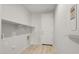 Laundry room with built-in shelving and a door at 1521 W Saddle Run, Apache Junction, AZ 85120