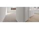 Bright hallway with carpeted floors and doors to other rooms at 1521 W Saddle Run, Apache Junction, AZ 85120