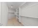 Large walk-in closet with shelves and hanging rods at 1521 W Saddle Run, Apache Junction, AZ 85120