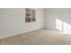 Bright bedroom with carpeted floor and window at 1521 W Saddle Run, Apache Junction, AZ 85120
