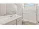 Updated bathroom with a walk-in shower, vanity with sink, and toilet at 1521 W Saddle Run, Apache Junction, AZ 85120
