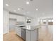 Modern kitchen with island, stainless steel appliances, and white cabinets at 1521 W Saddle Run, Apache Junction, AZ 85120