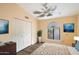 Bright bedroom with double door closet and wood-look flooring at 17302 E Oro Grande Dr, Fountain Hills, AZ 85268