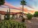 House exterior at sunset, showcasing desert landscaping and architectural details at 17302 E Oro Grande Dr, Fountain Hills, AZ 85268