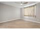 Bright bedroom with neutral walls and tile flooring at 10308 E Michigan Ave, Sun Lakes, AZ 85248