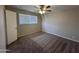 Spacious bedroom with ceiling fan and carpet flooring at 1629 E 2Nd Ave, Mesa, AZ 85204