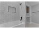 Clean bathroom with white subway tiles and a bathtub at 12222 N 74Th St, Scottsdale, AZ 85260