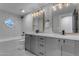 Modern bathroom with double vanity, subway tile and gold accents at 12222 N 74Th St, Scottsdale, AZ 85260