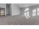 Large bedroom with neutral carpet and arched window at 12222 N 74Th St, Scottsdale, AZ 85260